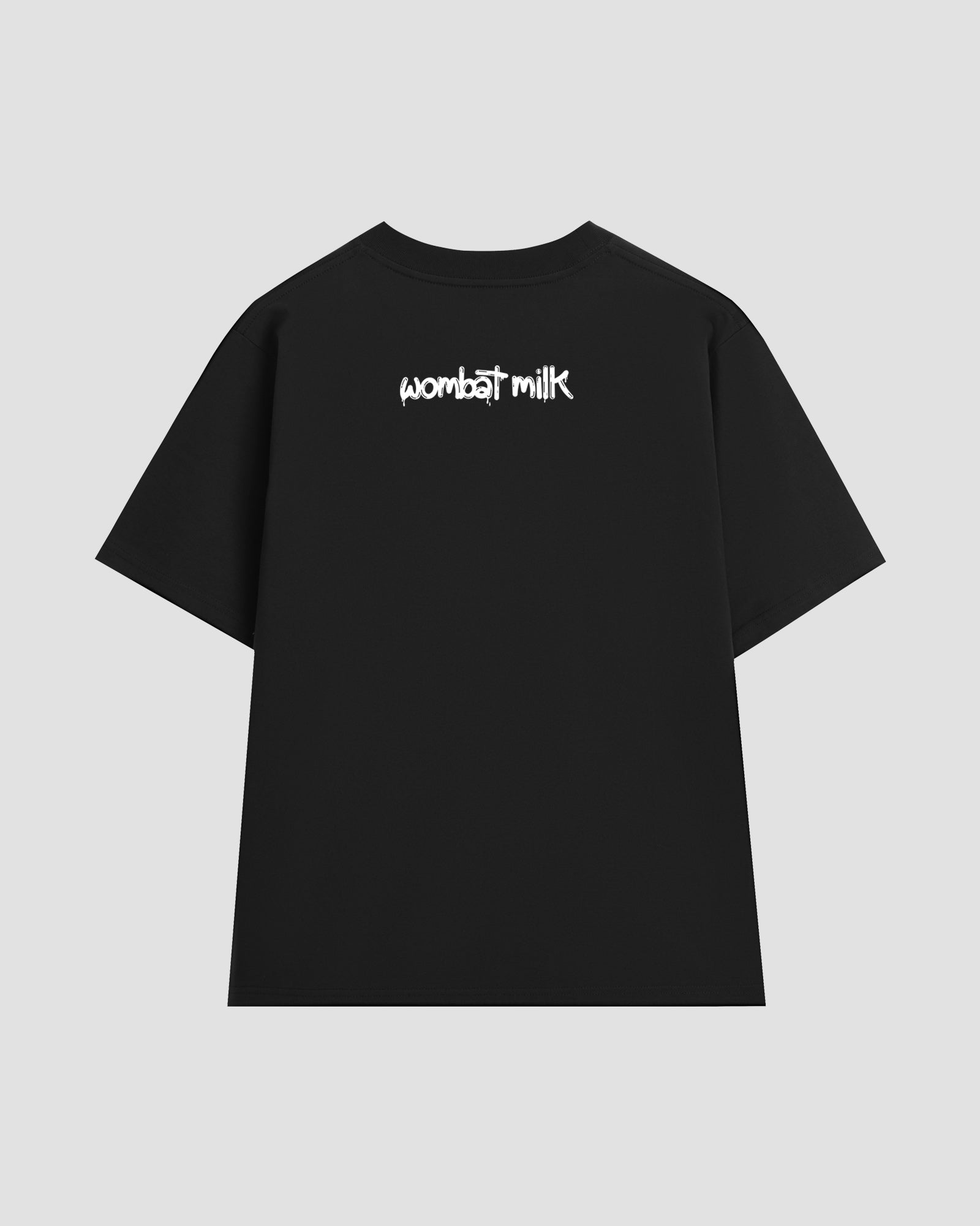 Black t-shirt with 'wombat milk' text on the back against a light grey background.