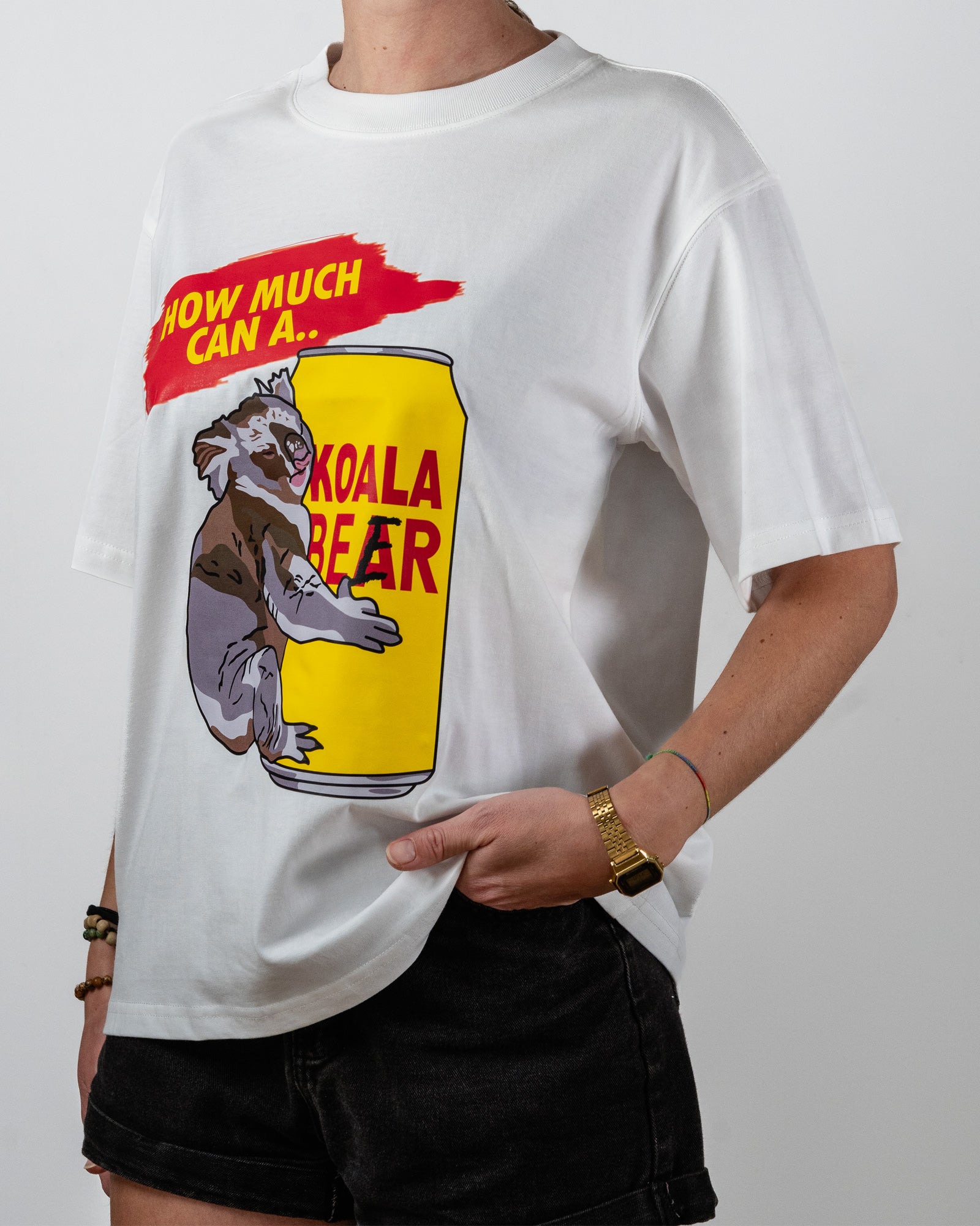 Person wearing a white t-shirt with a koala beer graphic design.