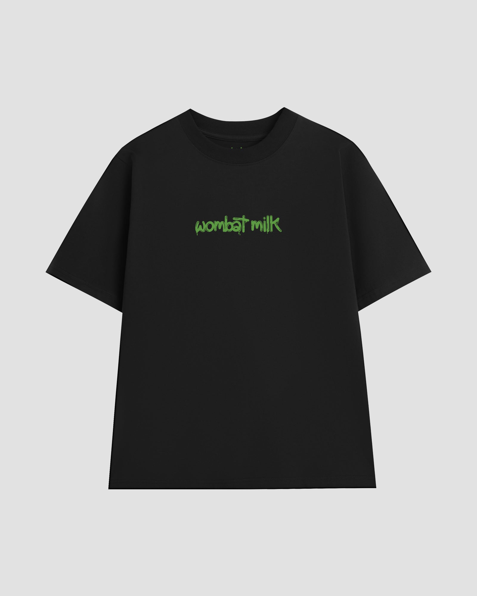 Black unisex t-shirt featuring a bright green 'Wombat Milk' logo graphic centred on the chest.