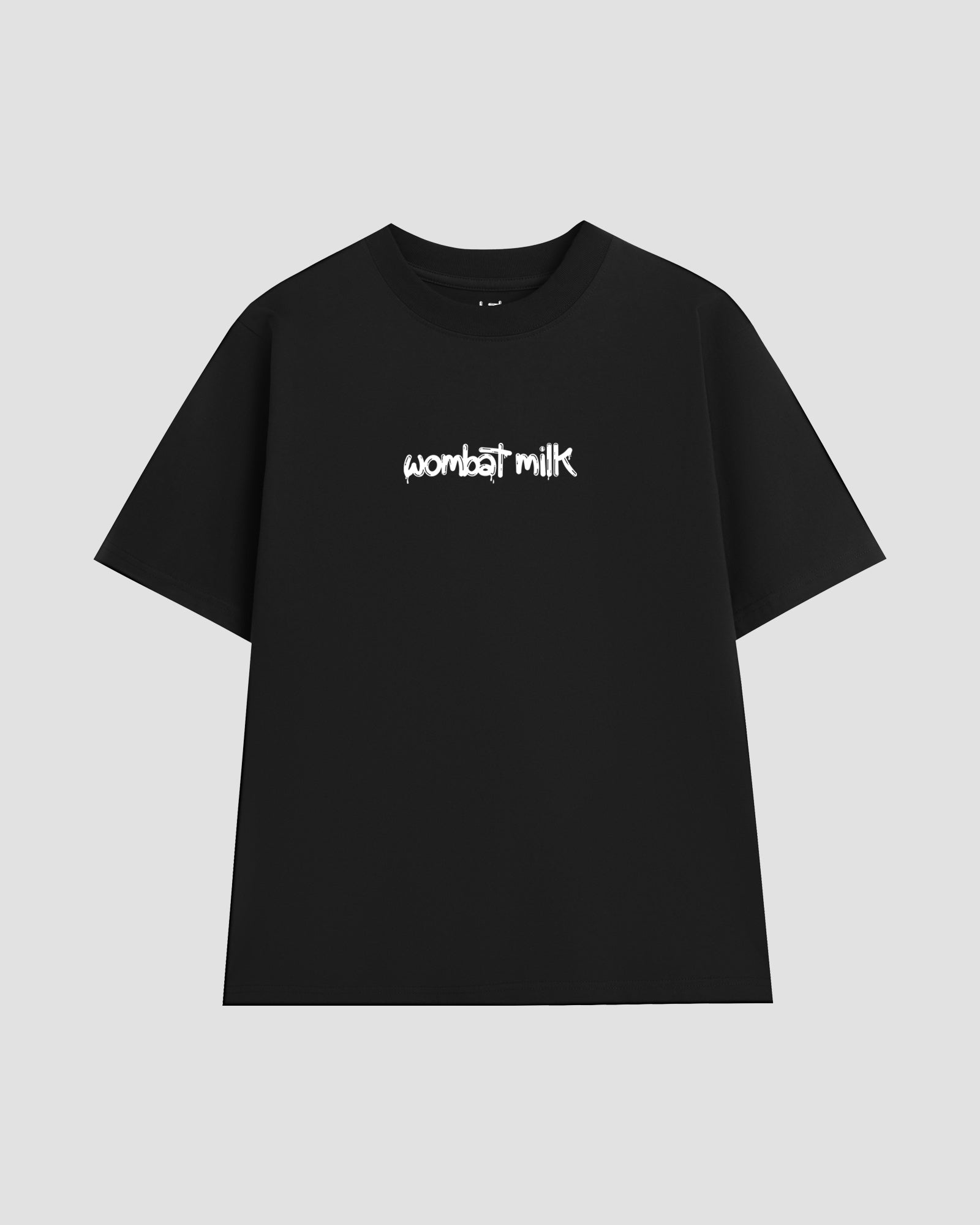 Black unisex t-shirt featuring a white 'Wombat Milk' logo graphic centred on the chest.