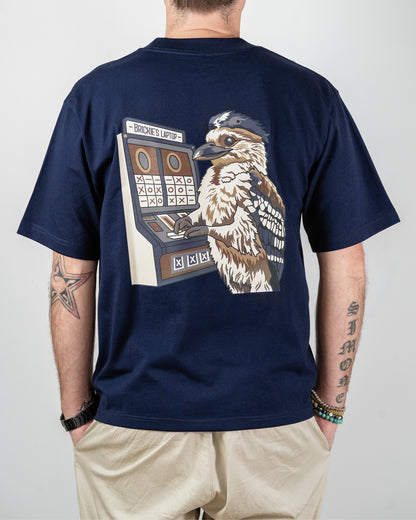 Navy t-shirt with a graphic of a bird and slot machine on the back, worn by a person and with the words "Brickie's Laptop".