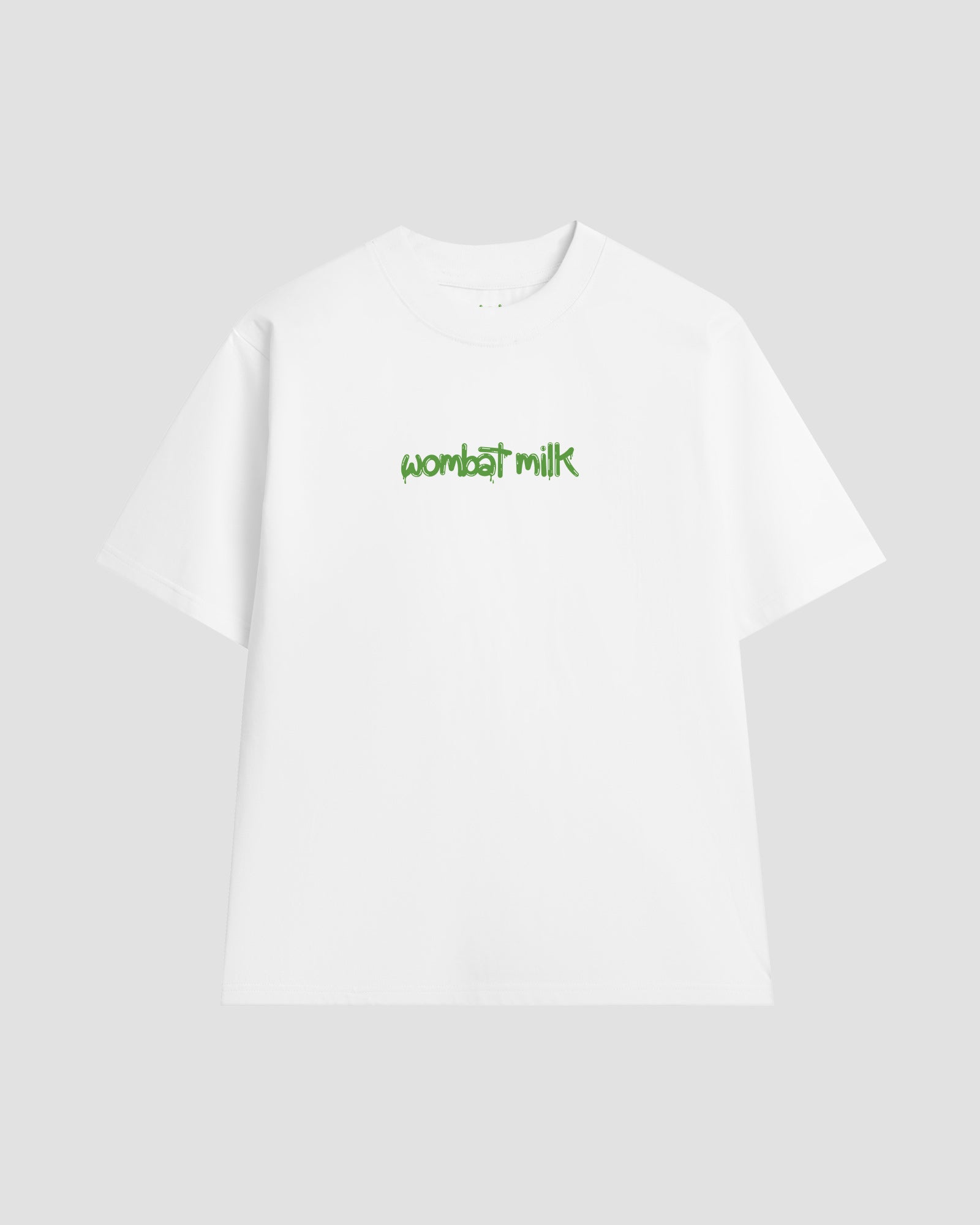 White unisex t-shirt featuring a bright green 'Wombat Milk' logo graphic centred on the chest.
